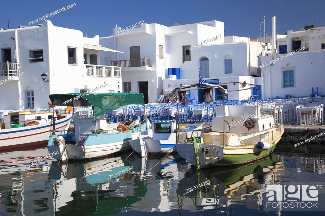 Stock Photo: Whitewashed houses and traditional boats at the small harbour in Naoussa village, Paros Island, Cyclades Islands, Greek Islands, Greece, Europe.
