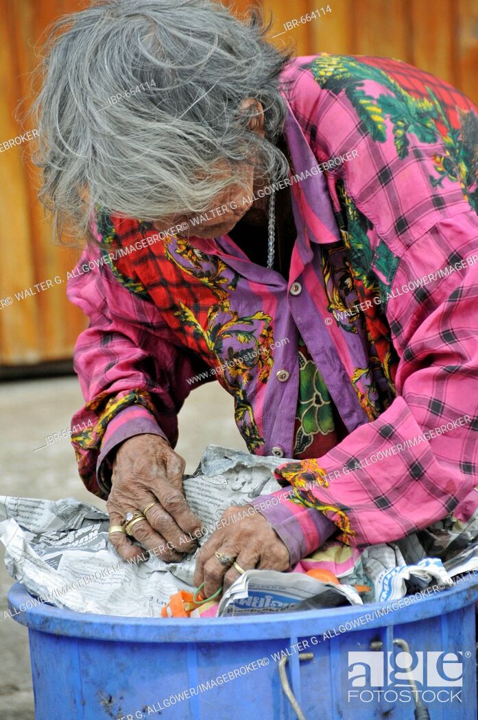 Stock Photo: Old-age poverty: woman sorting through trash in Sukhothai, Thailand, Southeast Asia, Asia.