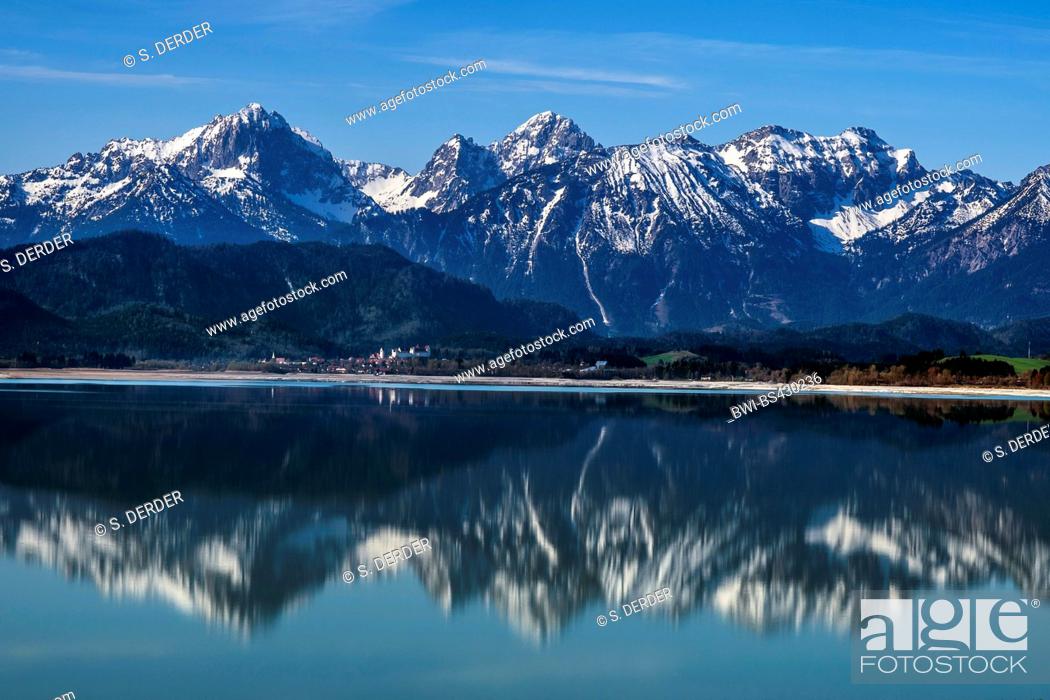 Stock Photo: Tannheim Mountains mirroring in lake Forggensee, Germany, Bavaria, Allgaeu.