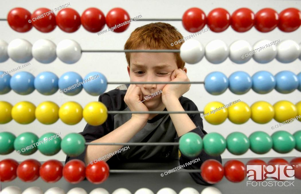 Stock Photo: Boy with abacus. - BONN, GERMANY, 15/04/2004.