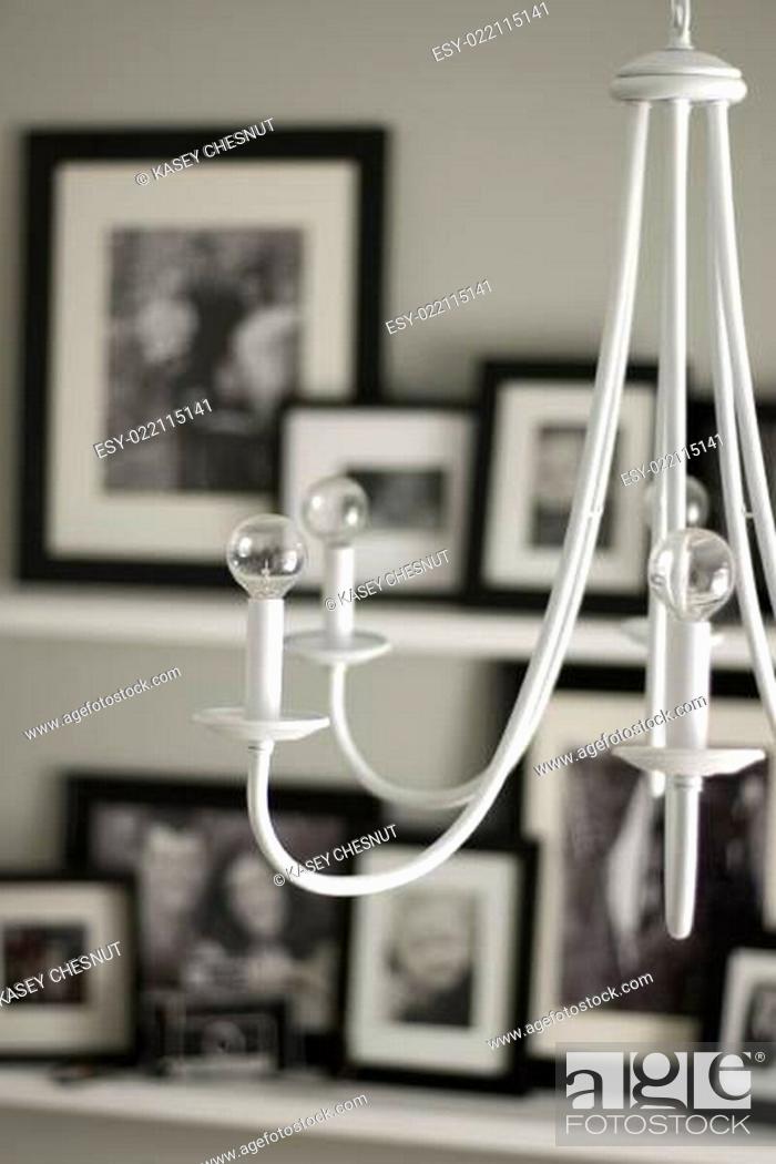 Stock Photo: white chandelier hanging in modern house portrait view.