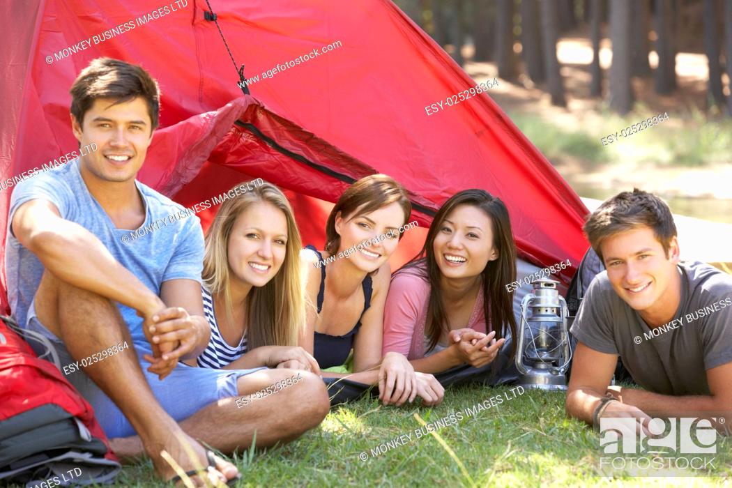 Stock Photo: Group Of Young People On Camping Holiday Together.