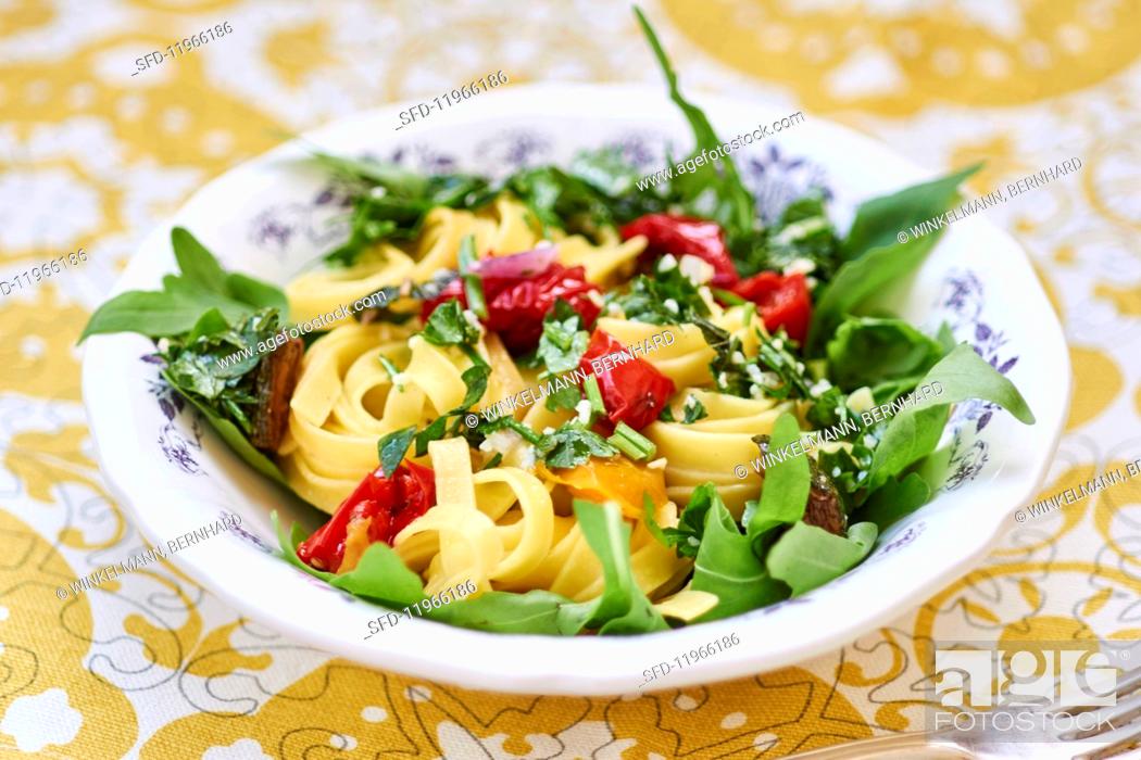 Stock Photo: Tagliatelle with peppers, rocket and garlic oil.