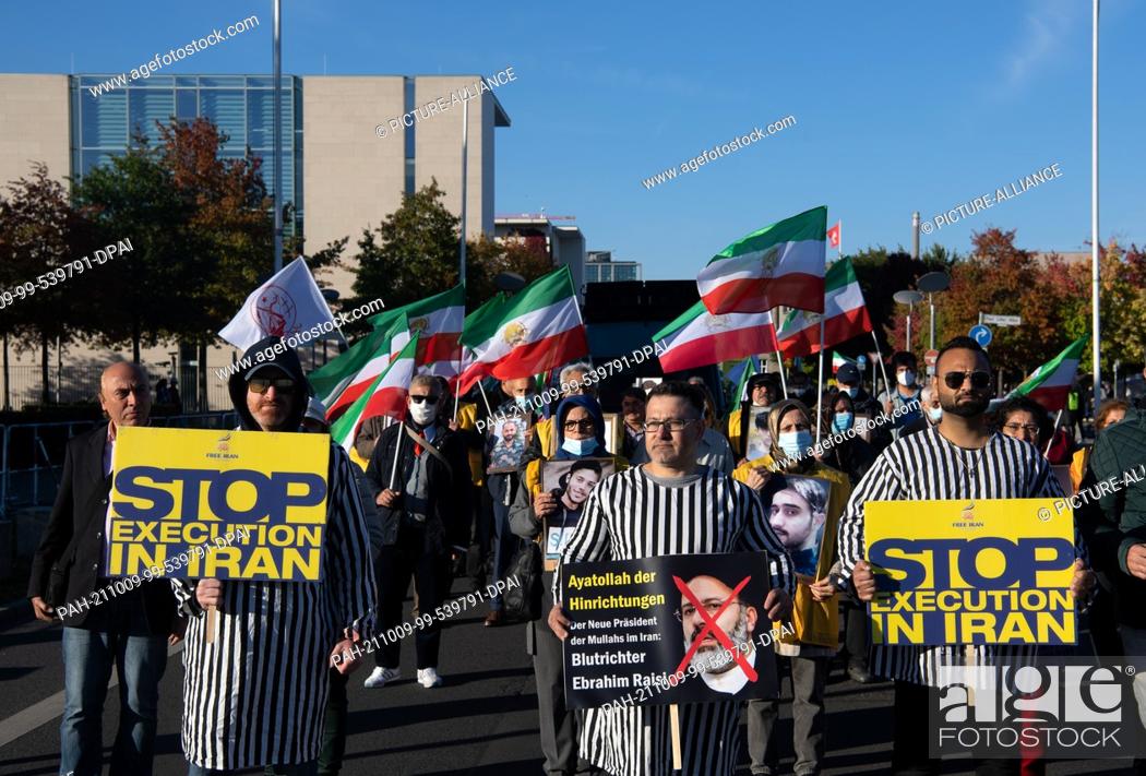Stock Photo: 09 October 2021, Berlin: Numerous supporters of the National Council of Resistance of Iran are demonstrating against the government in Iran on the occasion of.