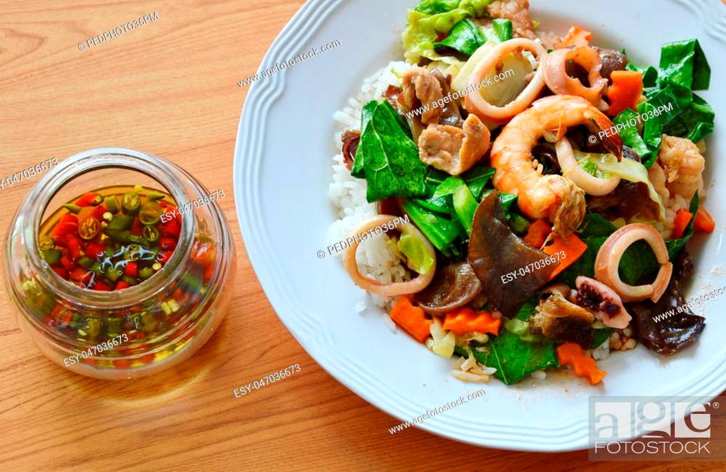 Stock Photo: stir fried mixed vegetable with seafood and chili fish sauce.