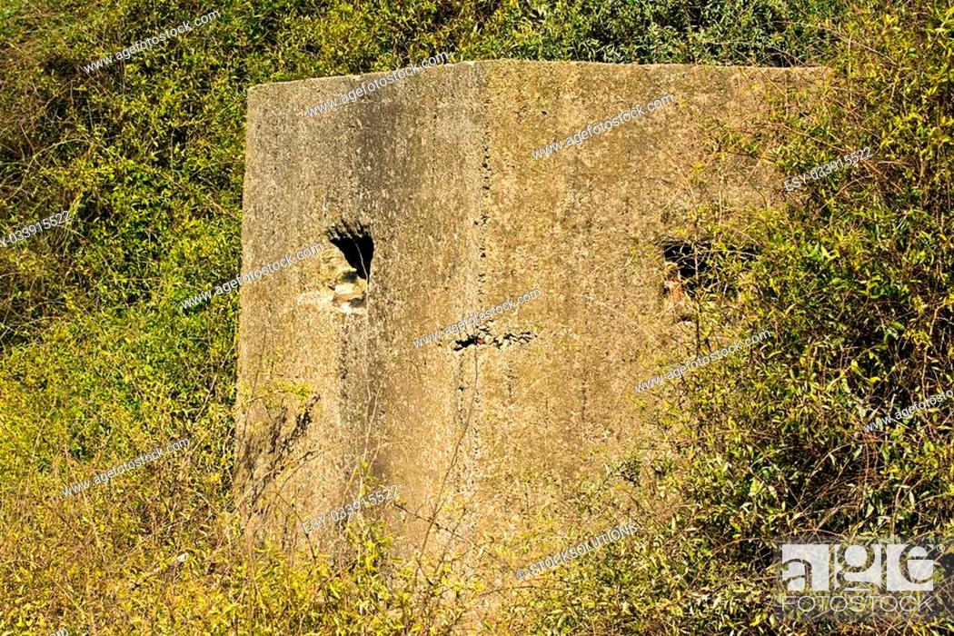 Stock Photo: Old ruin of a an allied world war two bunker in the uk commonly called a pillbox.