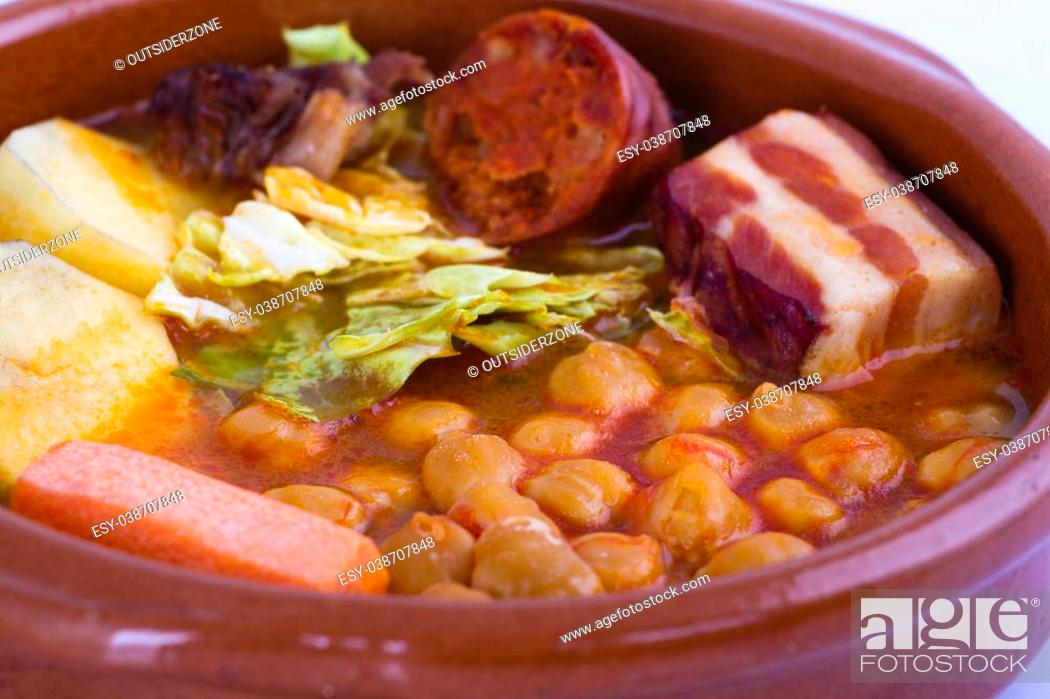 Stock Photo: Madrid stew on earthenware pot, spanish food.