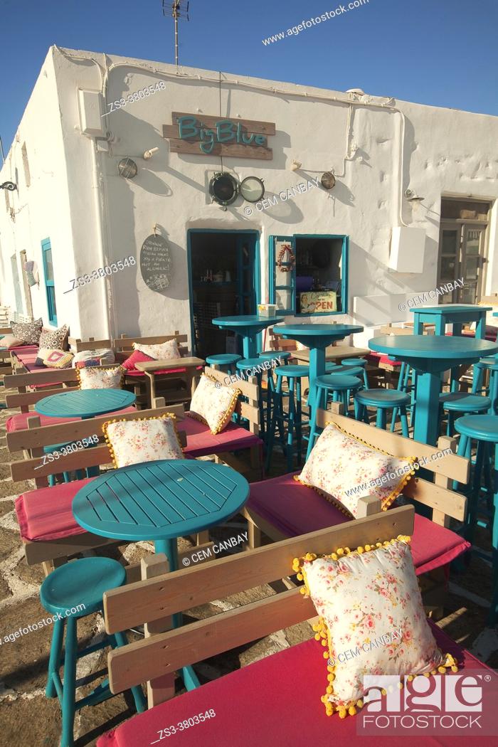 Stock Photo: Tables and chairs of a fancy bar-restaurant at the town center, Naoussa, Paros Island, Cyclades Islands, Greek Islands, Greece, Europe.