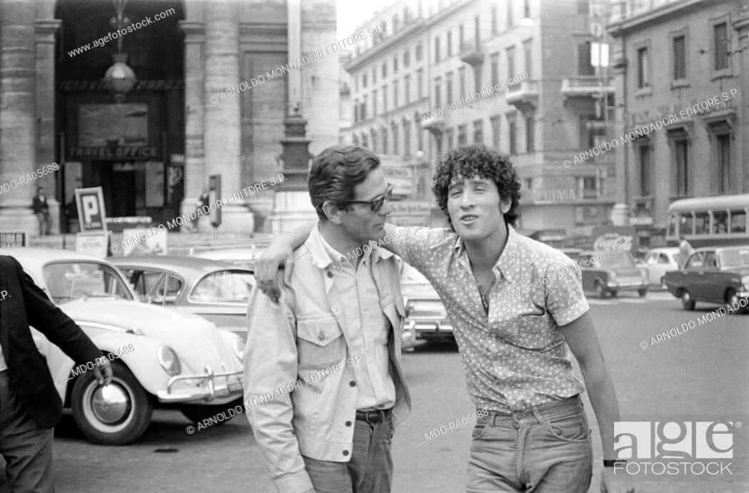 Stock Photo: Italian writer and director Pier Paolo Pasolini talking to talian actor Ninetto Davoli on the set of the segment The sequence of the paper flower.