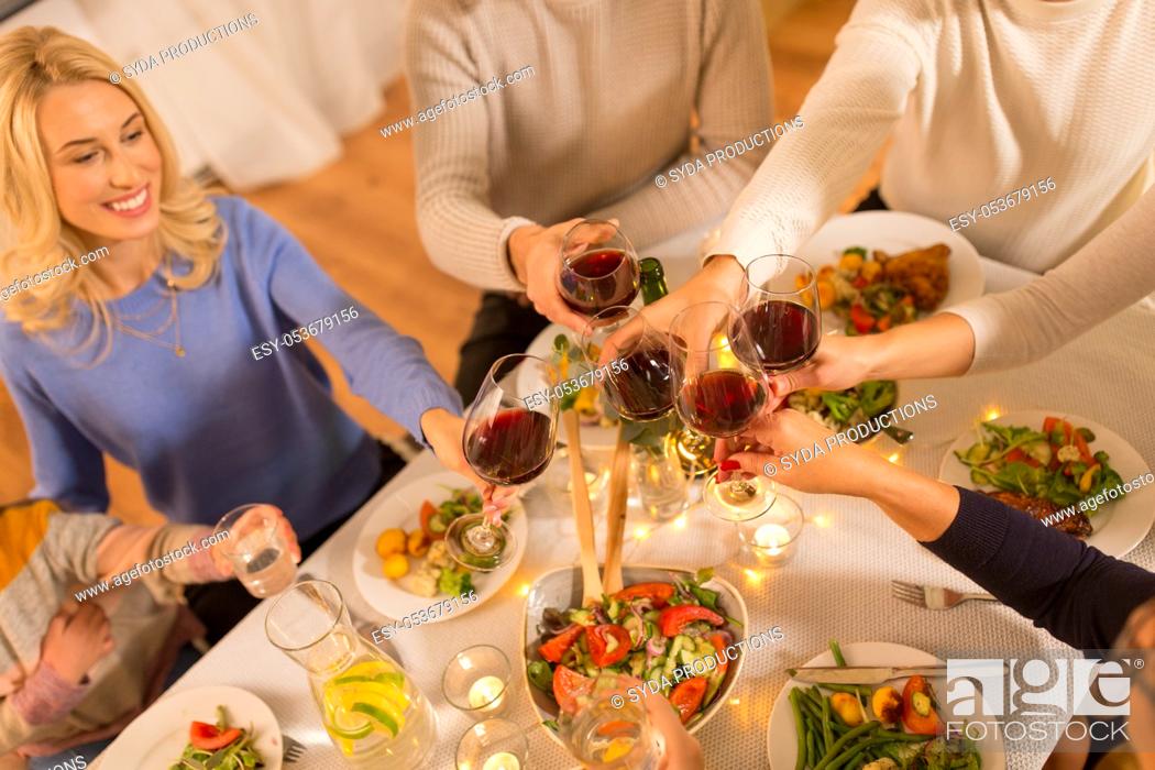 Stock Photo: happy family having dinner party at home.