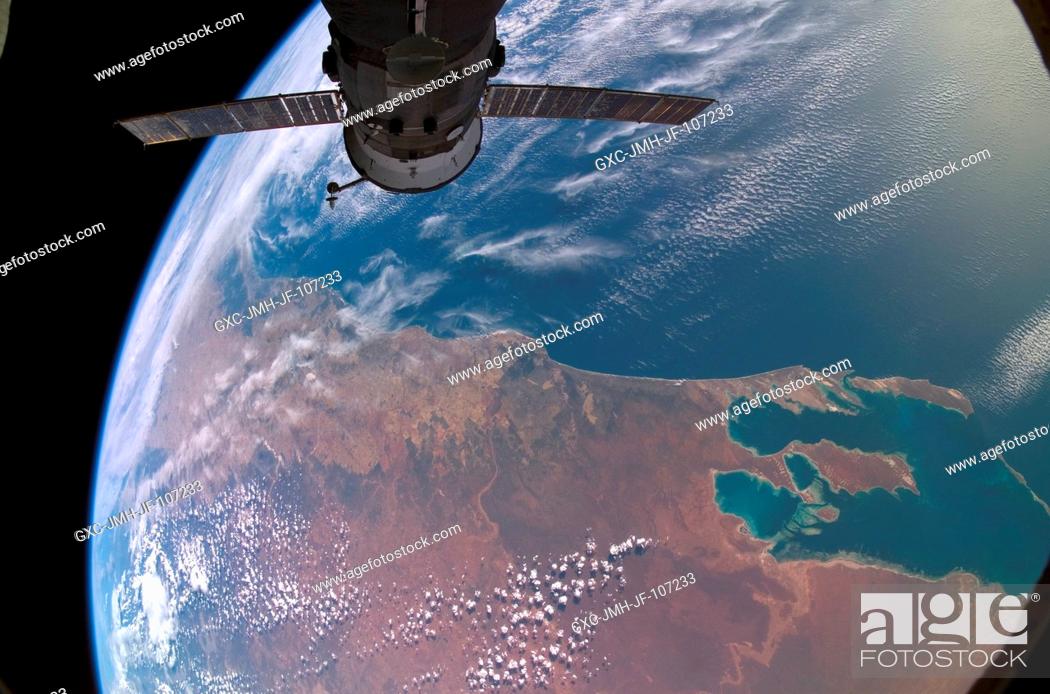 Stock Photo: Backdropped against a colorful part of Earth, Progress 23 supply vehicle docked to the Zvezda Service Module's aft port of International Space Station.