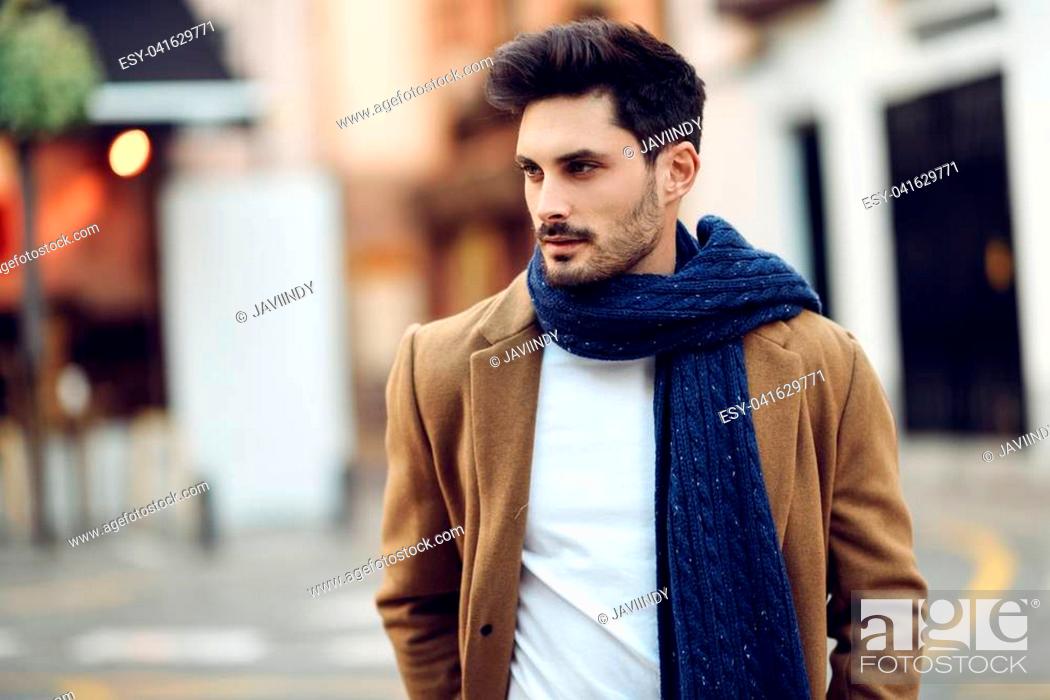 Young man wearing winter clothes in the street. Young bearded guy with  modern hairstyle with coat, Stock Photo, Picture And Low Budget Royalty  Free Image. Pic. ESY-041629771 | agefotostock