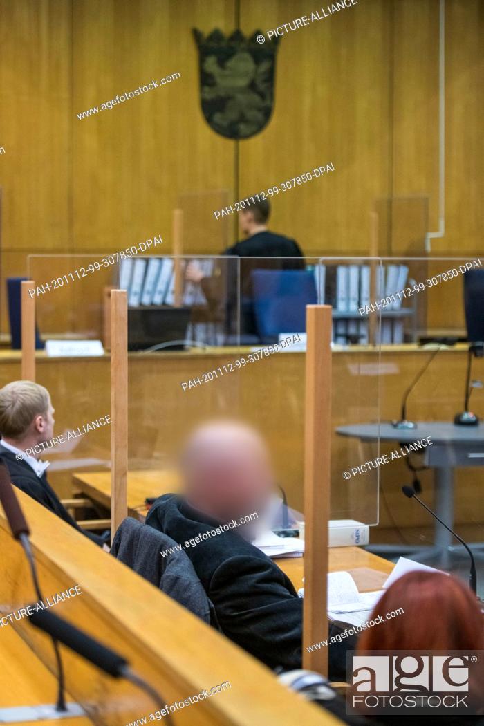 Stock Photo: 12 November 2020, Hessen, Frankfurt/Main: Markus H. (front, M), co-defendant for accessory to murder, sits between his lawyers Björn Clemens (l) and Nicole.