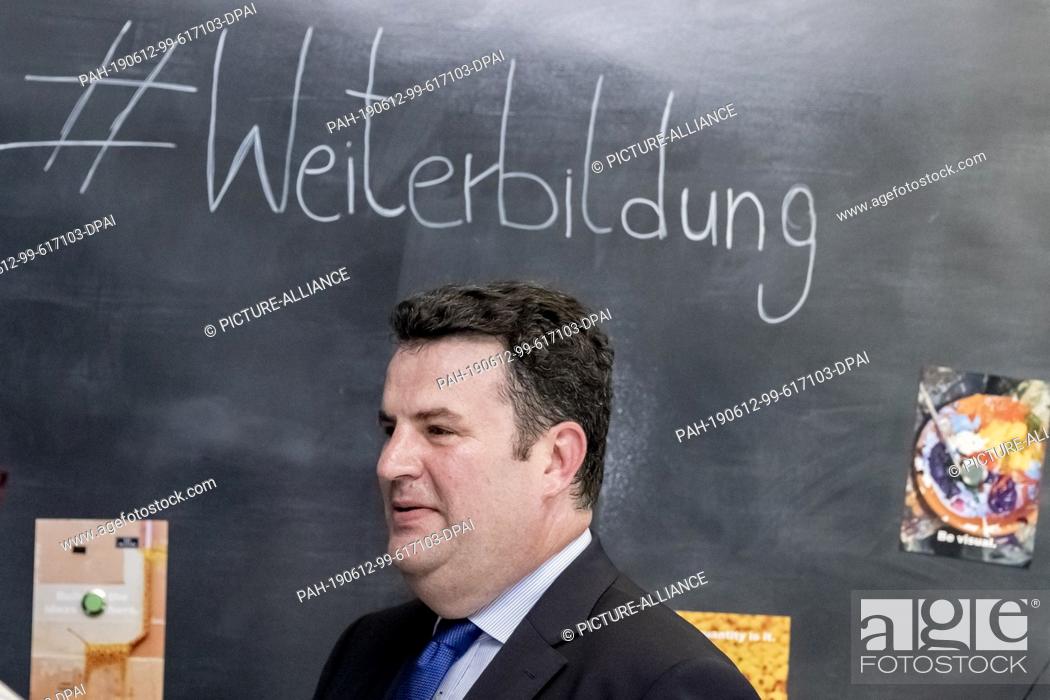 Stock Photo: 12 June 2019, Berlin: Hubertus Heil (SPD), Federal Minister of Labour, runs at the end of a press conference to present the National Continuing Education.