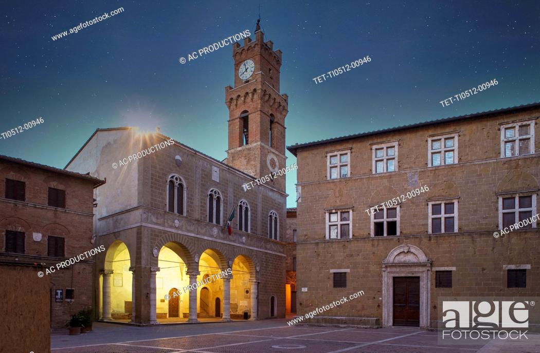 Stock Photo: Italy, Tuscany, Val D'Orcia, Pienza, Municipal palace illuminated at night.