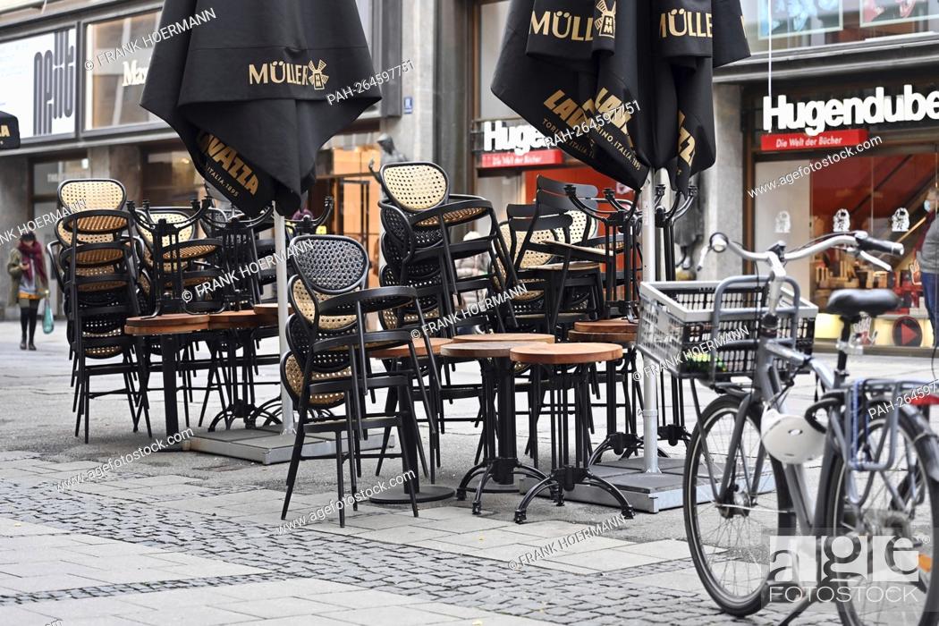 Stock Photo: Topic picture: Gastronomy in the coronavirus pandemic, stacked chairs and tables in front of a Bavarian restaurant, beer garden.
