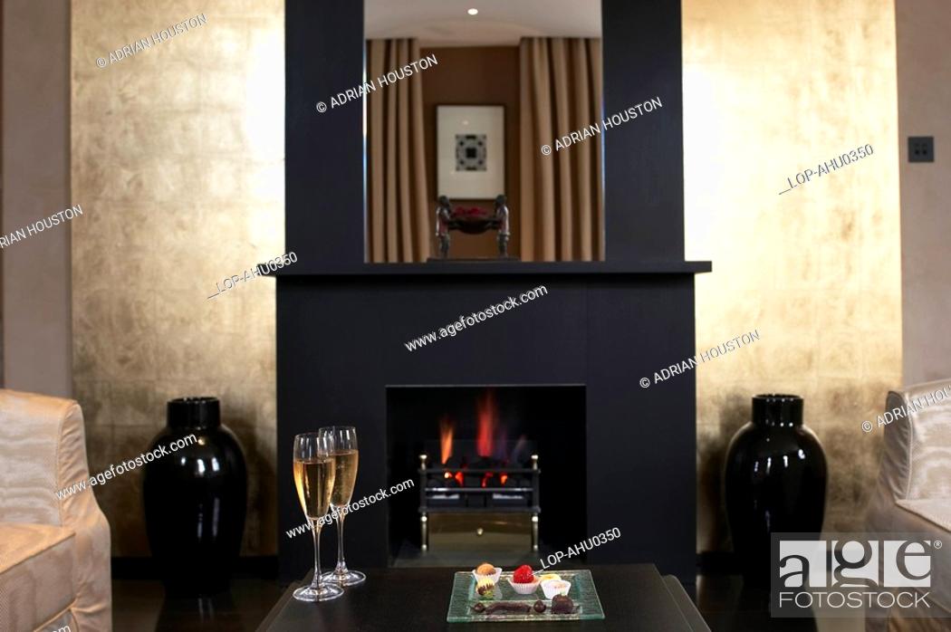 Stock Photo: England, London, Kensington, A fireplace at Baglioni Hotel.