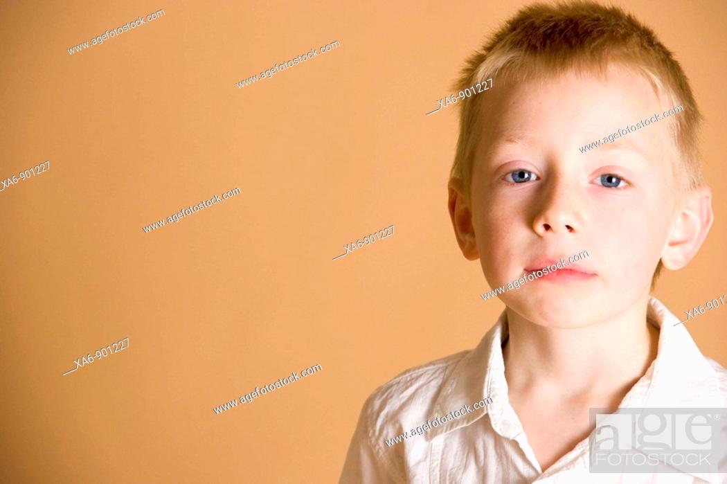 Stock Photo: A young boy, looking slightly anxious.