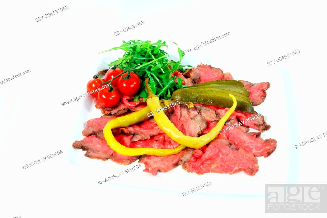 Stock Photo: Roastbeef with gherkin and hot pepper on white background.