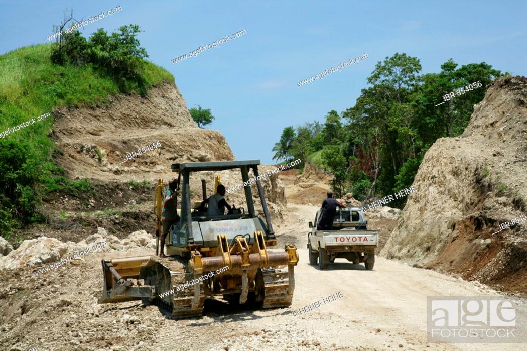 Stock Photo: Earth mover building a road for the refinery and harbour area of the Ramu Nickel Mine, chinese mining company, Basamuk, Papua New Guinea, Melanesia.