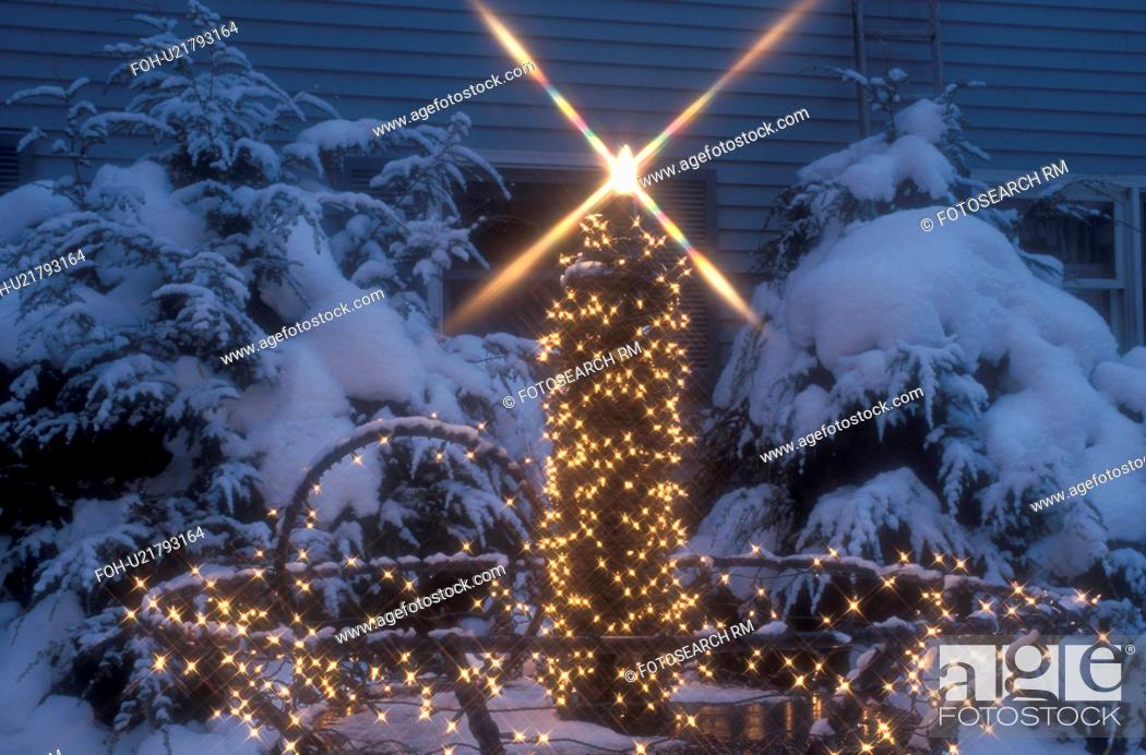 Stock Photo: candle, Christmas, decorations, holiday, Stowe, outdoor, evening, winter, A large candle outside the Siebeness Country Inn is trimmed with tiny white lights and.
