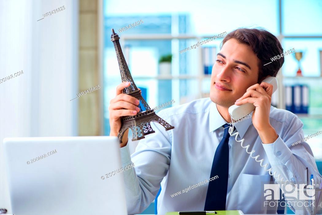 Stock Photo: Sales agent working in travel agency.