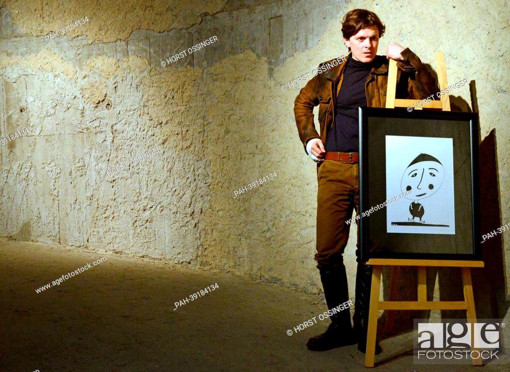 Stock Photo: Irish-American musician and artist Paddy Kelly poses next to his painting 'Sad Man' during a press conference in Duesseldorf,  Germany, 02 May 2013.