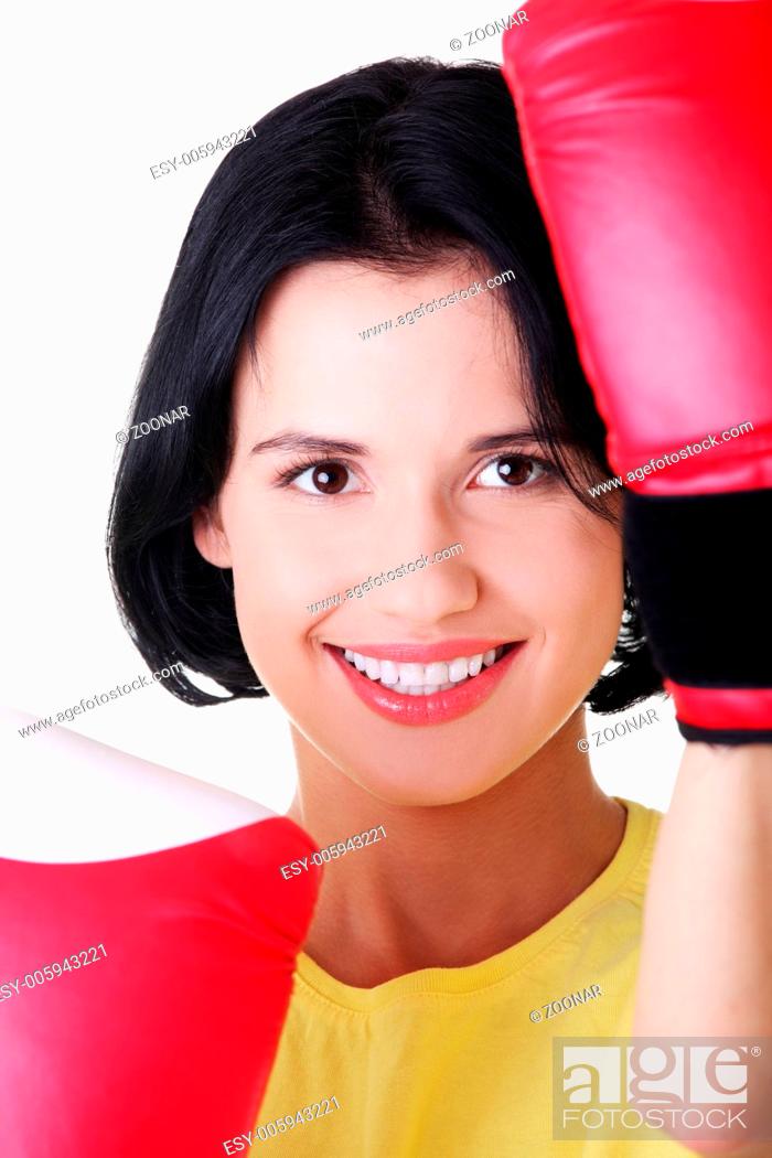Photo de stock: Young woman wearing a pair of boxing gloves.