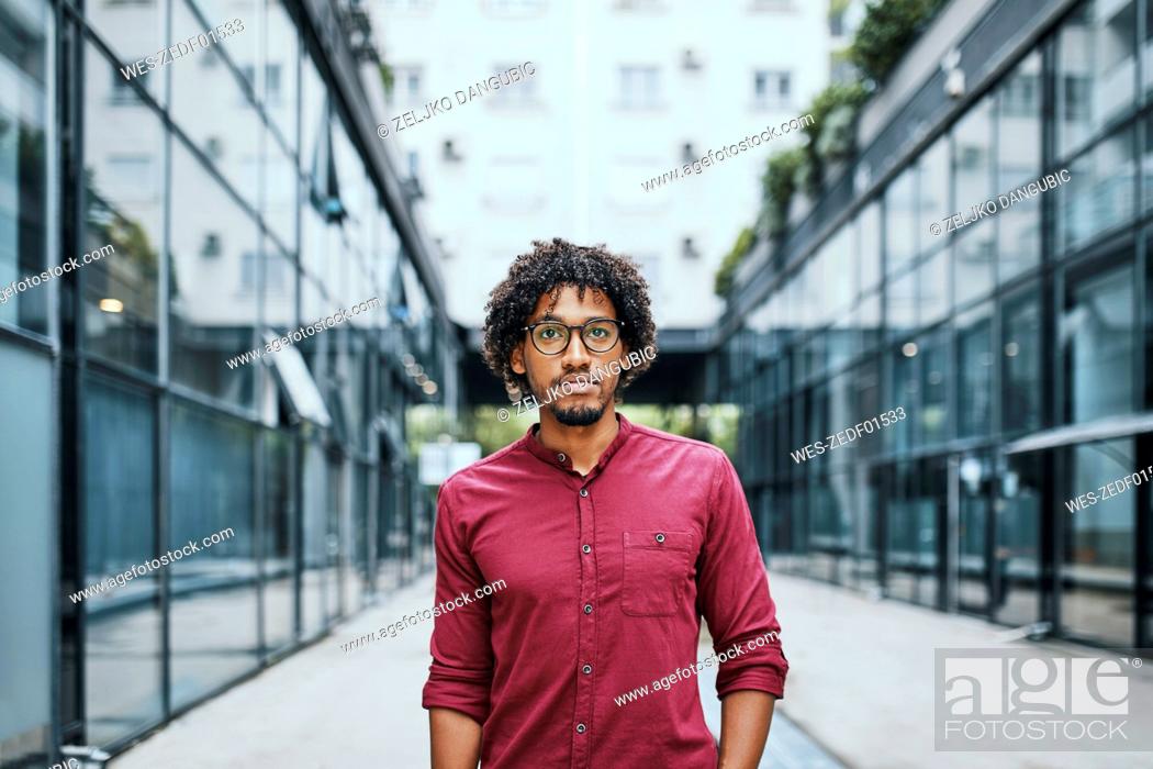Stock Photo: Portrait of a young man wearing glasses.