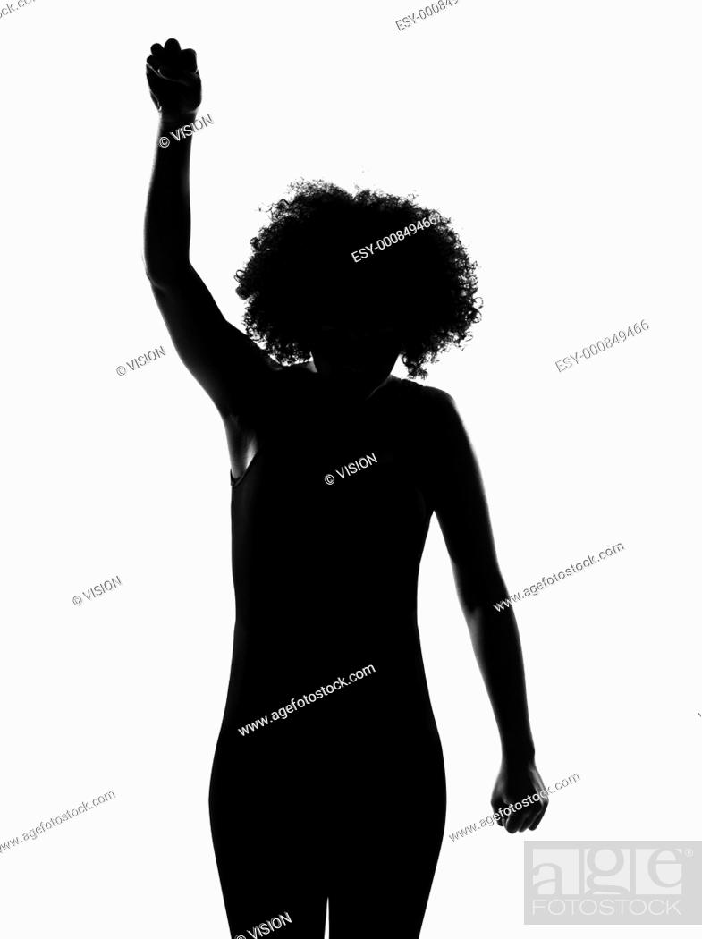 beautiful funny young afro american woman rebel fist up in silhouette shadow  on studio isolated..., Stock Photo, Picture And Low Budget Royalty Free  Image. Pic. ESY-000849466 | agefotostock