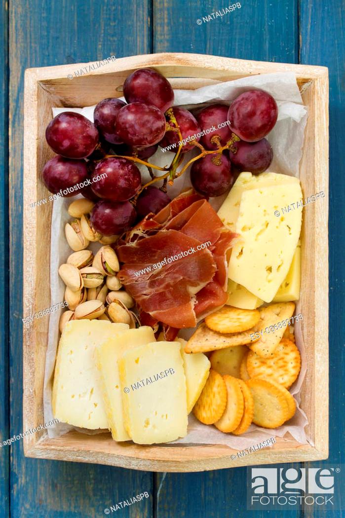 Stock Photo: cheese with meat, fruits and cookies.