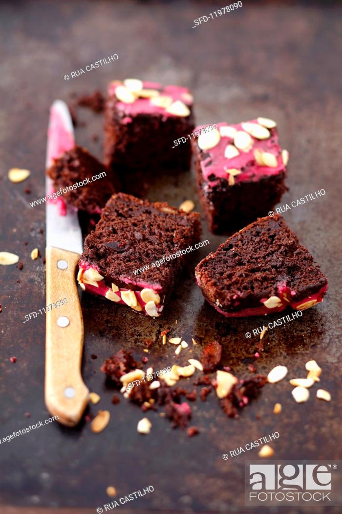 Stock Photo: Beetroot brownies with beetroot icing and slivered almonds.