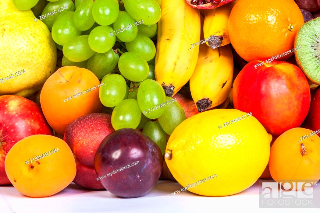 Stock Photo: Huge group of fresh fruits isolated on a white background. Shot in a studio.