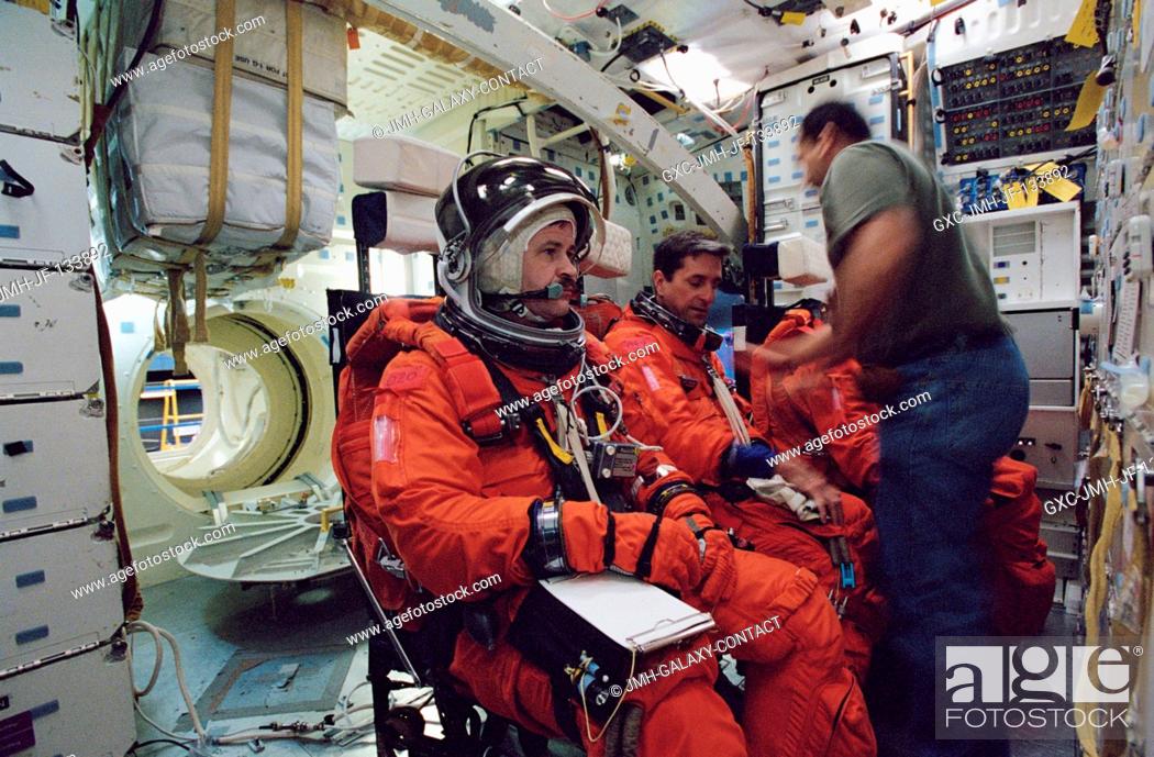 Stock Photo: Cosmonaut Nikolai M. Budarin (left) and astronaut Donald A. Thomas, both Expedition Six flight engineers, and astronaut Kenneth D.