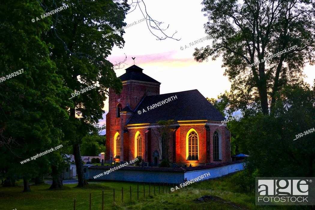 Stock Photo: Tyreso, Sweden The Tyreso Church at the Tyreso Palace grounds at sunset.