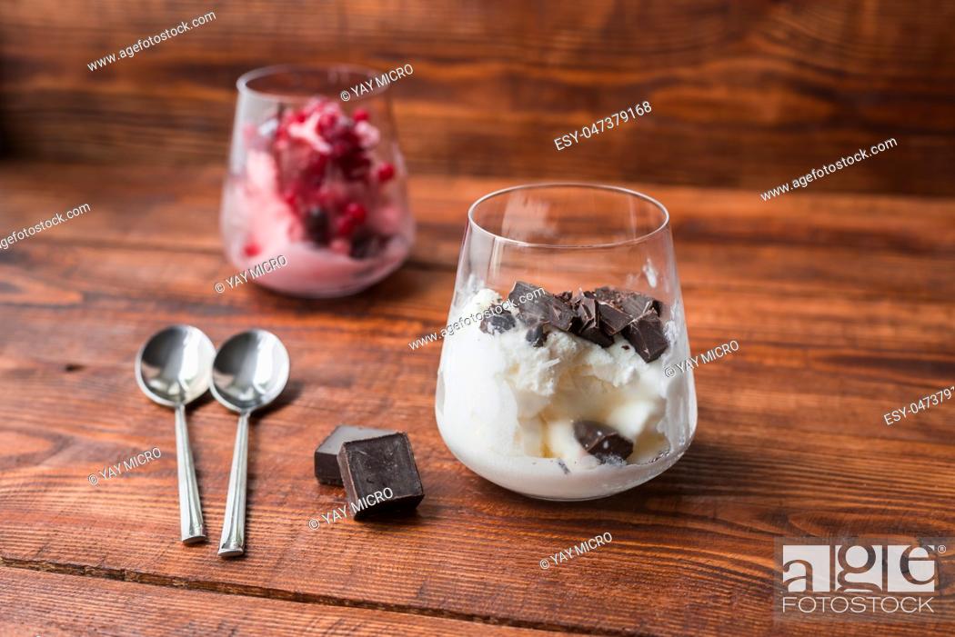 Stock Photo: Dessert for two. Vanilla ice cream with chocolate and strawberry ice cream with red currant.