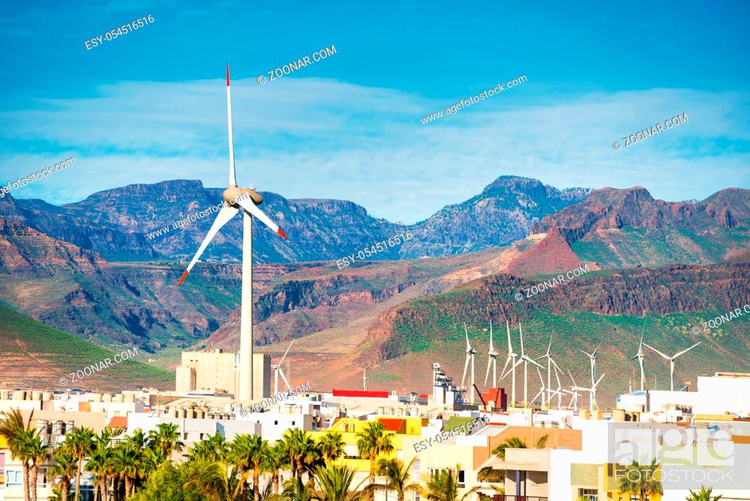 Stock Photo: Wind turbines in small town near mountains at Canary islands, Spain.