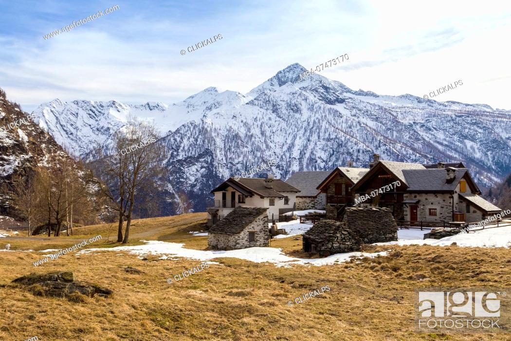 Stock Photo: View of the town of Cheggio and the mountains of Antrona valley from Alpe Cheggio, Antrona valley, Piedmont, Italy,.