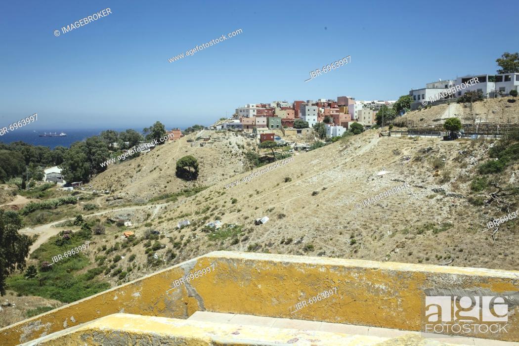 Stock Photo: View towards northwest on the slopes of the Los Rosales neighbourhood, on the slopes many migrants have built makeshift shelters and put up tents, Ceuta, Spain.
