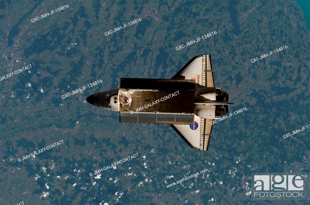 Stock Photo: Backdropped over a colorful Earth, Space Shuttle Atlantis is featured in this image photographed by an Expedition 15 crewmember after the shuttle undocked from.