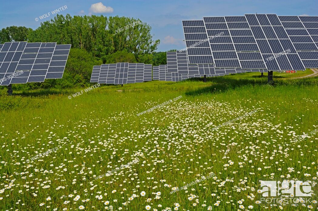 Stock Photo: Solarpark Mengeringhausen with static Modules and Modules, that follow the Azimuth of the Sun. They produce electricity in any position and angle.