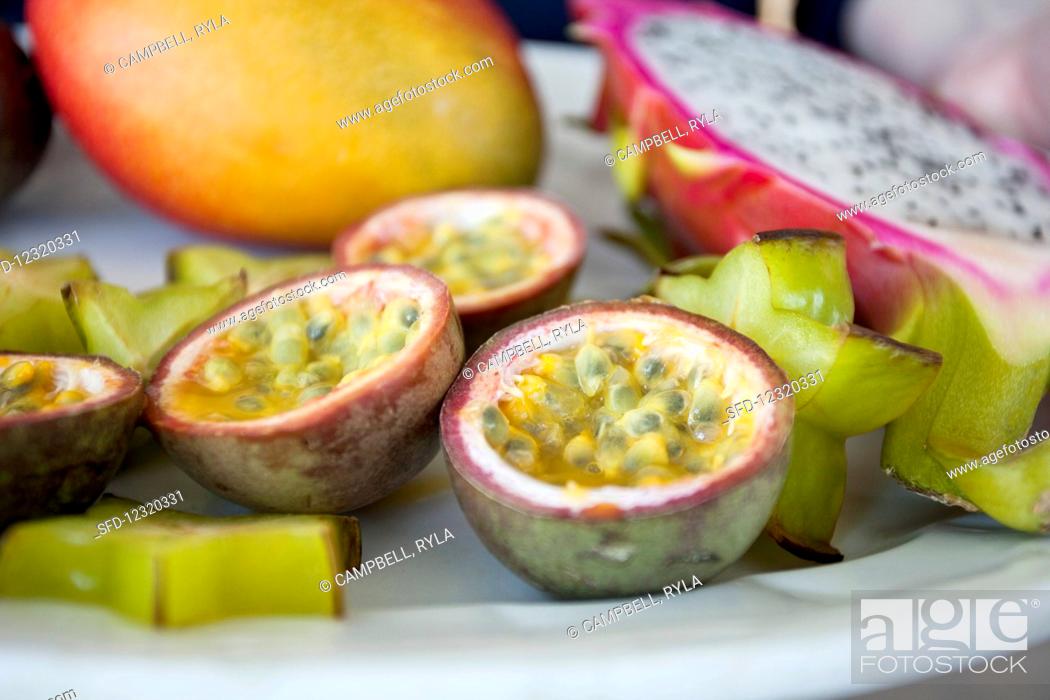 Stock Photo: No People, Close-Up, Still Life, Tranquil, Blurred, Indoors, Interior, Near, Variety, Inside, Arrangement, Food, Tropical, Fruit, Red, Plate, Raw, Fresh, Purple, Yellow, Nutrition, Multiple, Photo, Several, Uncooked, Type, Star, Exotic, Shot, Mixture