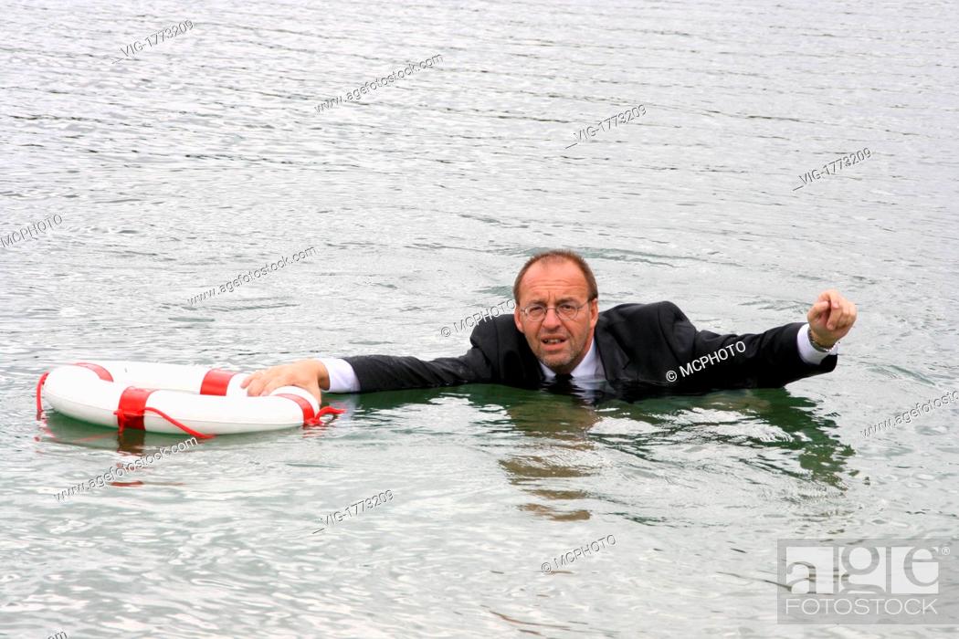 Stock Photo: manager stands in deep water - 01/01/2009.