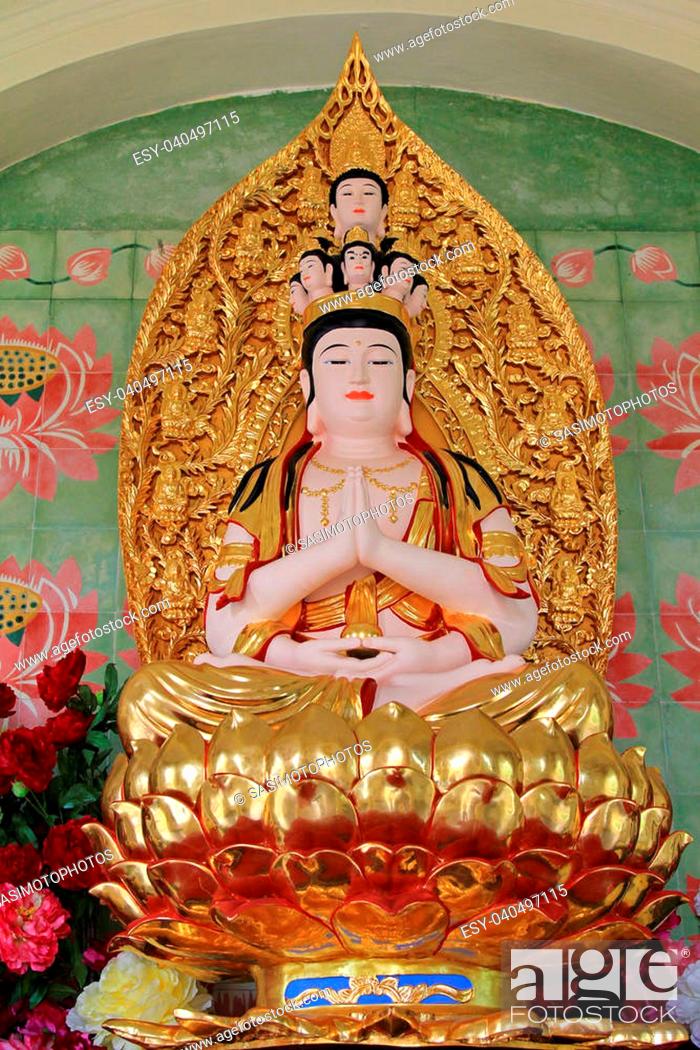 Stock Photo: Statue of Avalokitesvara sitting on lotus flower, at the Buddhist Temple of Supreme Bliss : Kek Lok Si, Penang, Malaysia.