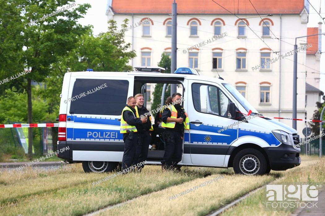 Stock Photo: 24 May 2018, Germany, Dresden: Police securing a trap circuit. Danger has not been completely averted after the part detonation of an aircraft bomb found in.