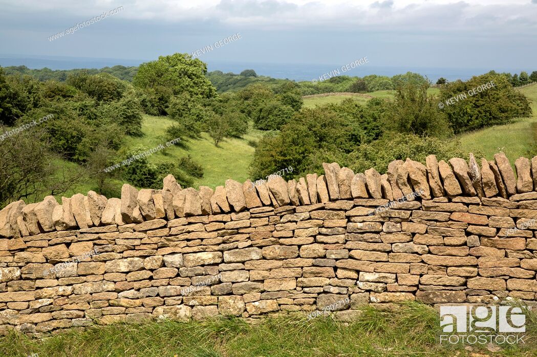Stock Photo: Countryside with Stone Wall, Broadway; Cotswolds; Worcestershire; England; UK.