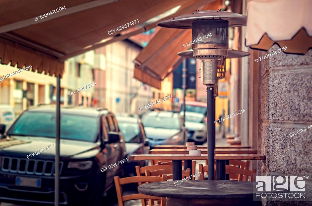 Stock Photo: Gas heater, patio heater, mushroom heater, umbrella heater. Tables for eating outdoors.