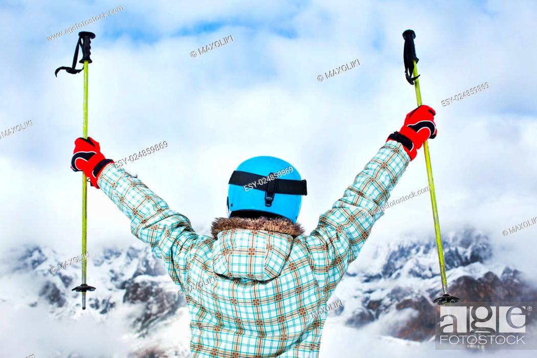 Stock Photo: Ski, skier, winter - back view of lovely girl has a fun on ski.