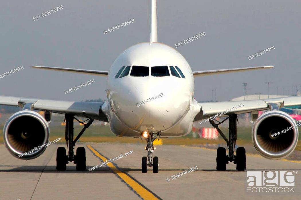 Stock Photo: White aircraft taxi on taxiway at the airport.