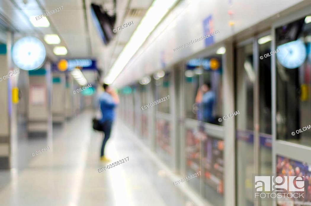 Stock Photo: Blurred people standby train coming at the train station.